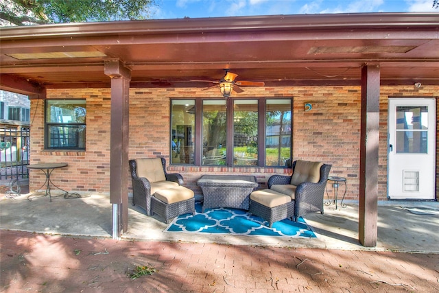 view of patio with outdoor lounge area and ceiling fan