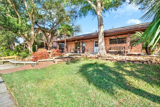 rear view of house with a lawn