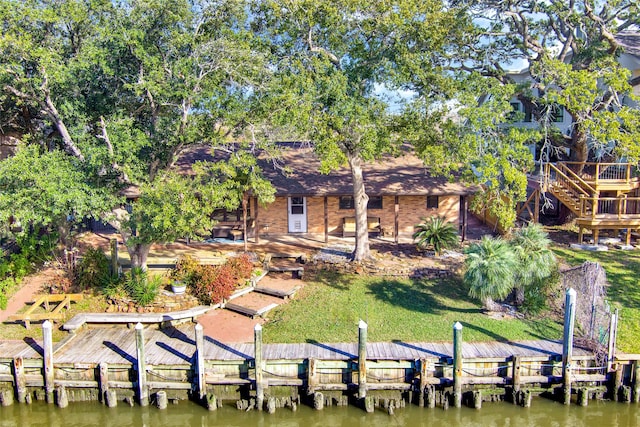 dock area featuring a yard and a water view