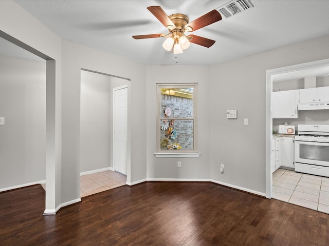 interior space with ceiling fan and light hardwood / wood-style flooring