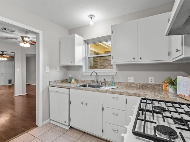 kitchen with ceiling fan, sink, dishwasher, white cabinetry, and light tile patterned flooring