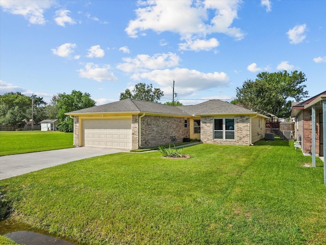 ranch-style house featuring a garage and a front lawn