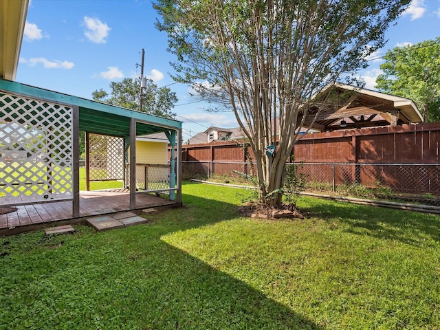 view of yard featuring a deck