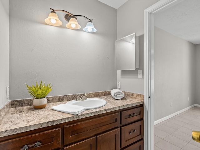 bathroom featuring tile patterned flooring and vanity