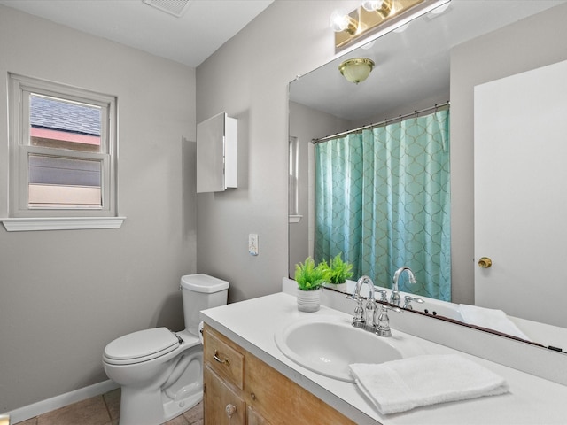 bathroom with tile patterned floors, curtained shower, vanity, and toilet