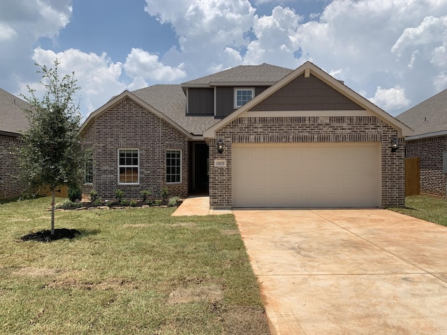 view of front facade with a front yard and a garage