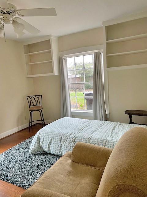 bedroom featuring ceiling fan and hardwood / wood-style flooring