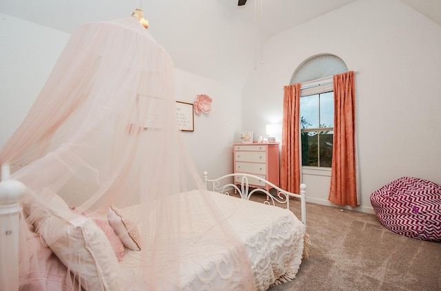 carpeted bedroom featuring vaulted ceiling and ceiling fan