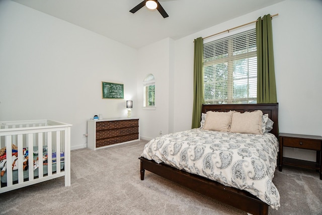 carpeted bedroom with ceiling fan