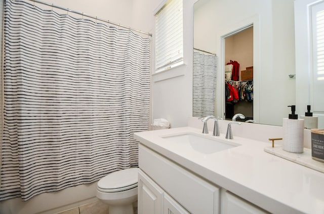 full bathroom with tile patterned floors, vanity, toilet, and shower / tub combo