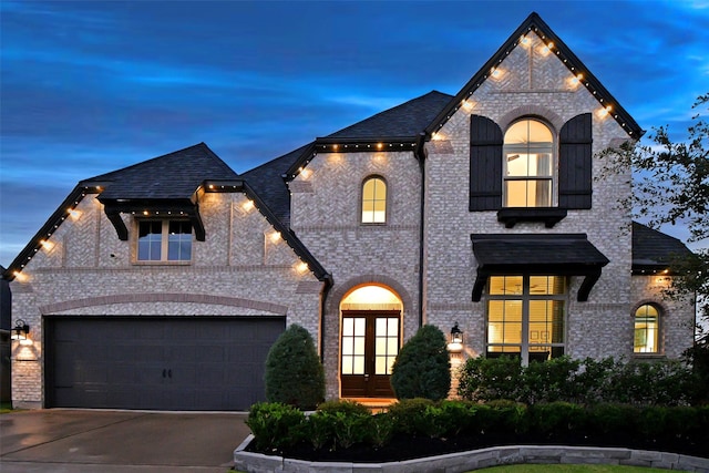 view of front of house with french doors and a garage