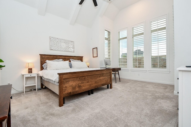 carpeted bedroom featuring ceiling fan and lofted ceiling with beams