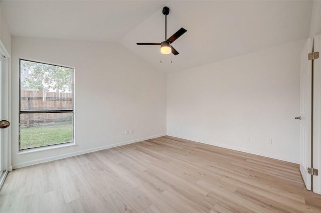 empty room with ceiling fan, light hardwood / wood-style flooring, and lofted ceiling