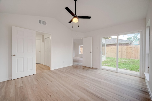 interior space featuring access to exterior, light wood-type flooring, ceiling fan, and lofted ceiling