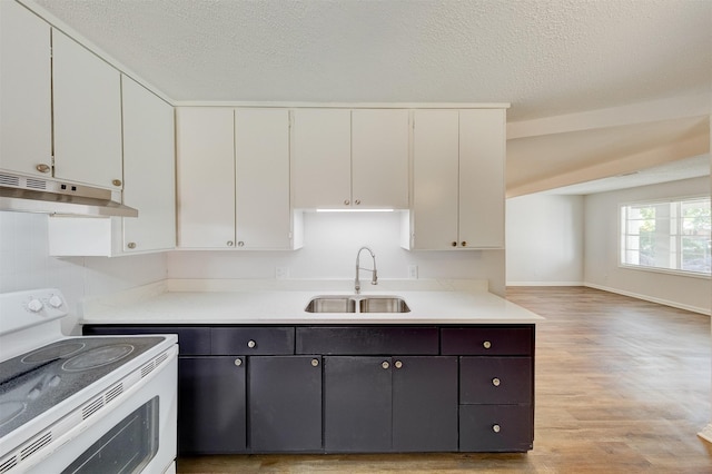 kitchen featuring white cabinetry, white range with electric stovetop, light hardwood / wood-style floors, and sink