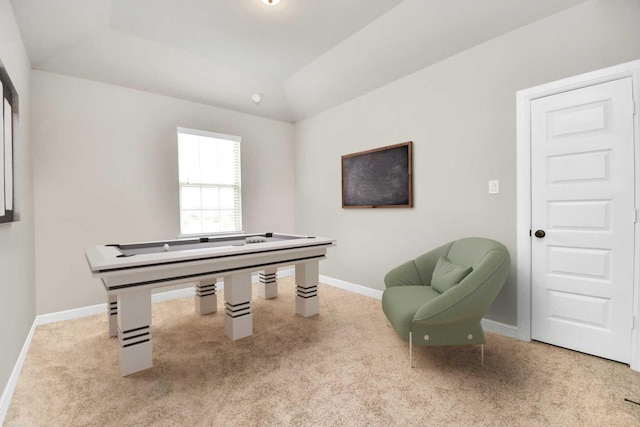 game room featuring lofted ceiling, light carpet, and a tray ceiling