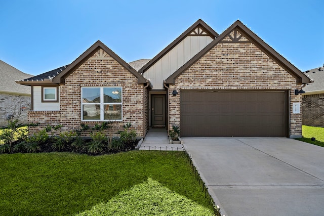 view of front of house featuring a front yard and a garage