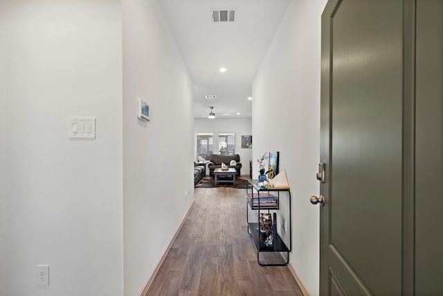 hallway featuring hardwood / wood-style flooring