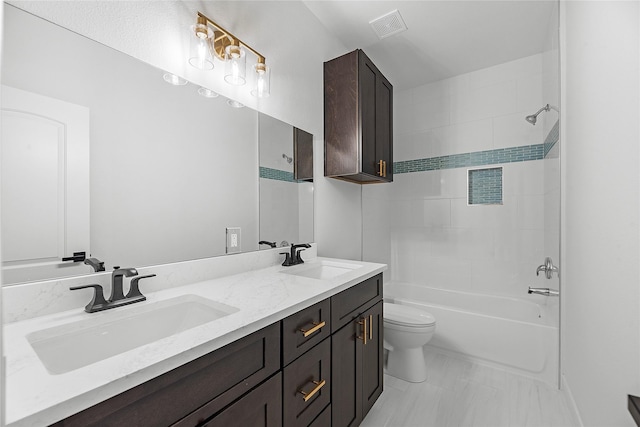 full bathroom featuring shower / washtub combination, vanity, and toilet