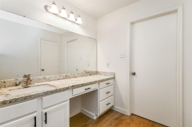 bathroom featuring vanity and wood-type flooring