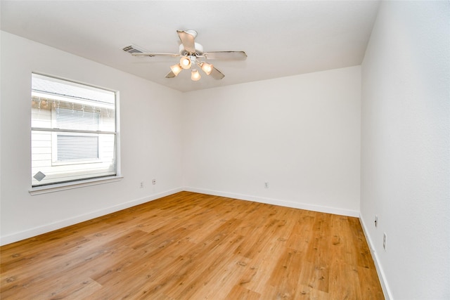 spare room featuring ceiling fan and light hardwood / wood-style flooring