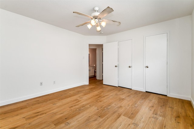 unfurnished bedroom with ceiling fan and light hardwood / wood-style flooring