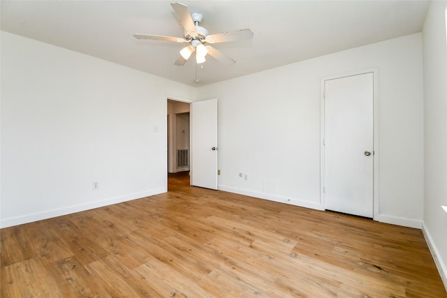 spare room featuring ceiling fan and light hardwood / wood-style floors