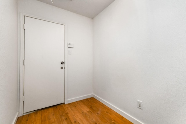 doorway featuring wood-type flooring