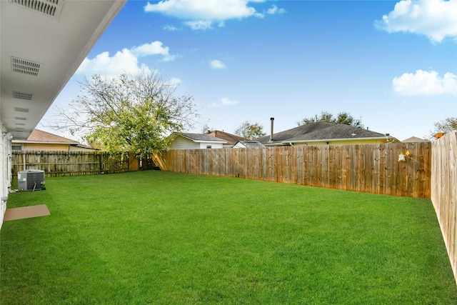 view of yard featuring central AC unit