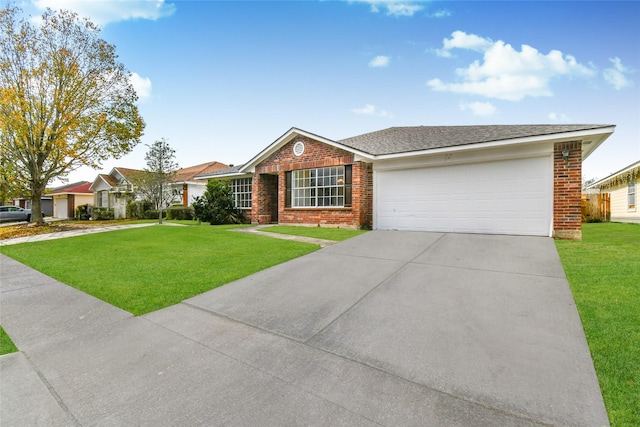 single story home with a garage and a front lawn