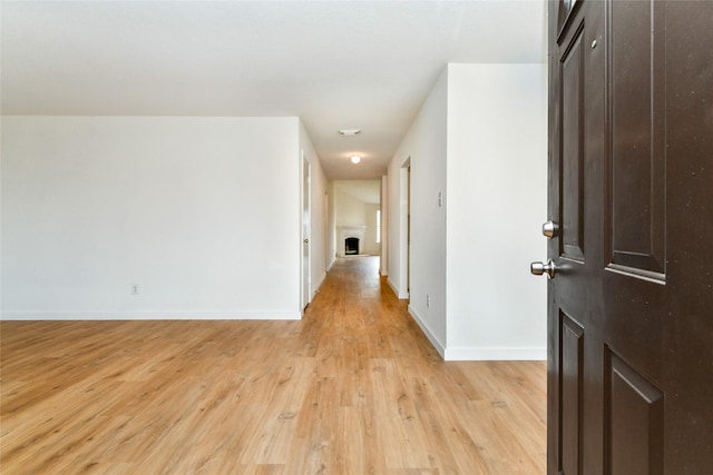 corridor featuring light hardwood / wood-style floors