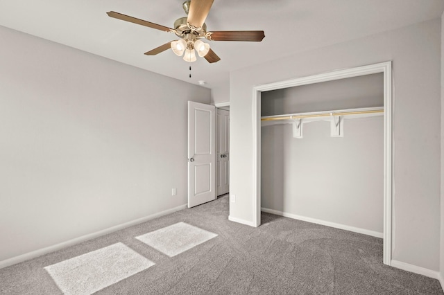 unfurnished bedroom featuring carpet, ceiling fan, and a closet