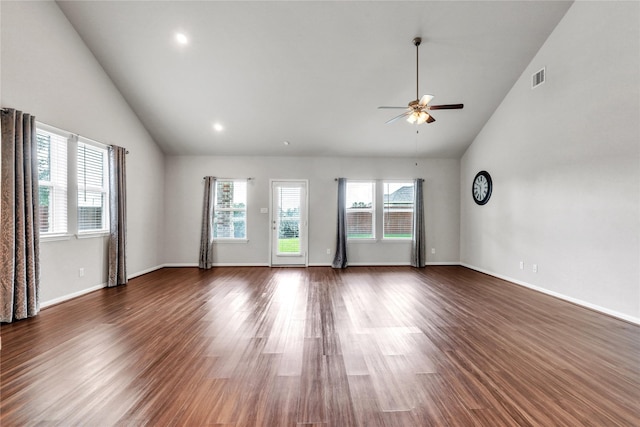 unfurnished room featuring vaulted ceiling, ceiling fan, and dark hardwood / wood-style floors