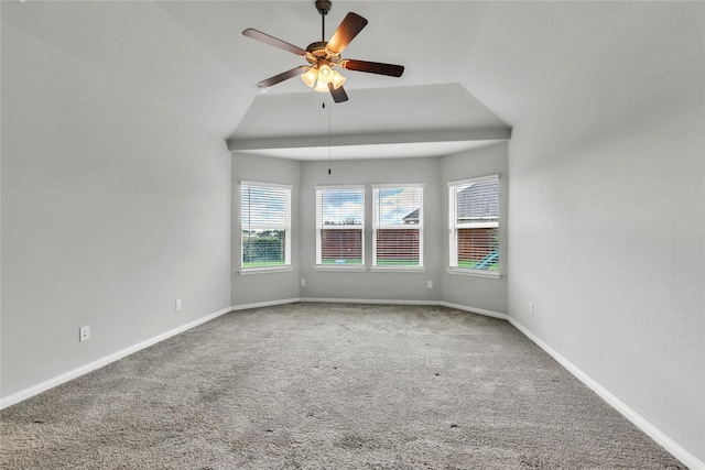 carpeted empty room featuring ceiling fan and lofted ceiling