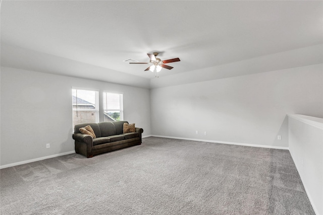 living area with ceiling fan and carpet floors