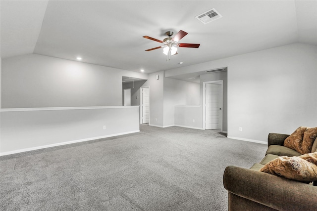 carpeted living room featuring ceiling fan and lofted ceiling