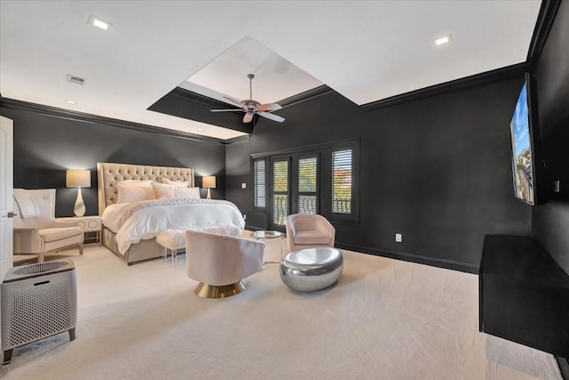 carpeted bedroom with ceiling fan and crown molding