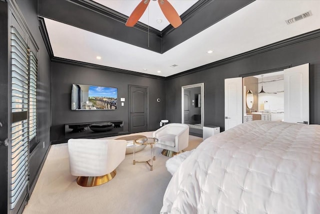 bedroom with light carpet, ensuite bathroom, ceiling fan, and crown molding