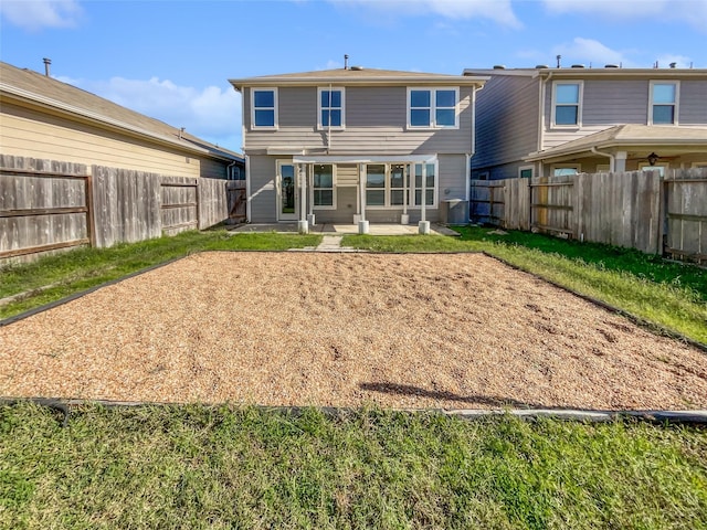 rear view of house featuring a patio area