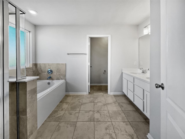 bathroom with vanity and a bathtub