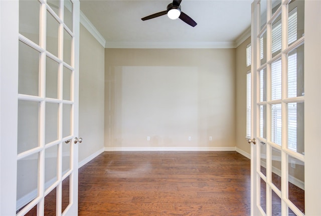 spare room featuring ceiling fan, crown molding, dark wood-type flooring, and french doors