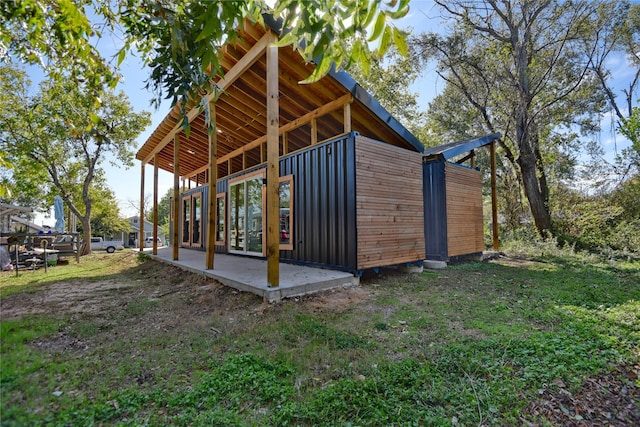 view of property exterior featuring a patio area