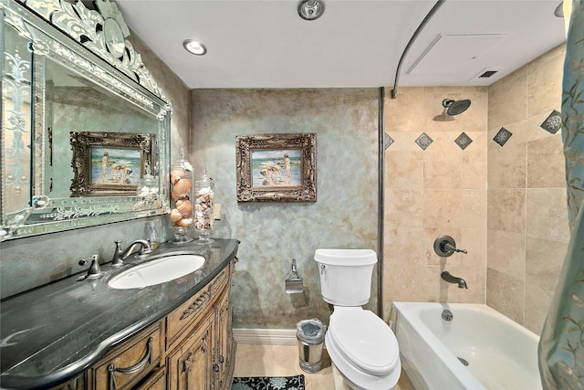 full bathroom featuring vanity, tile patterned floors, tiled shower / bath combo, and toilet