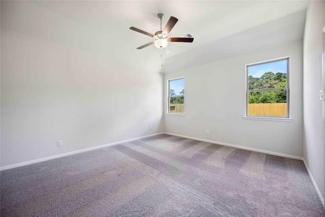 carpeted empty room featuring ceiling fan