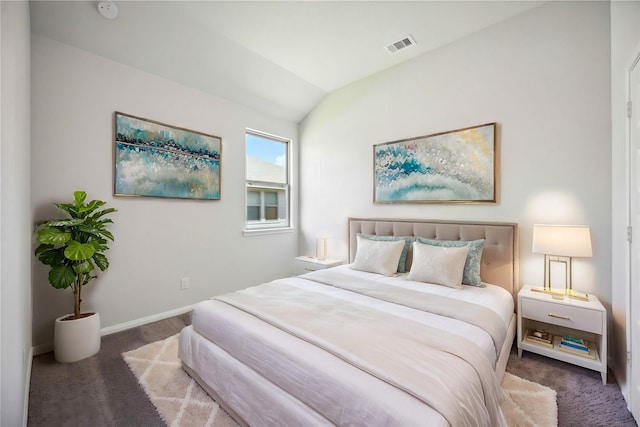 bedroom featuring carpet flooring and lofted ceiling