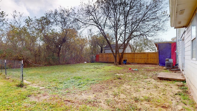 view of yard featuring central air condition unit