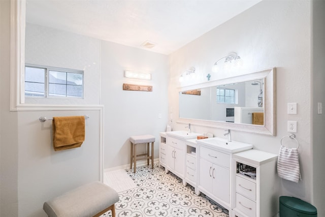 bathroom featuring tile patterned flooring and vanity