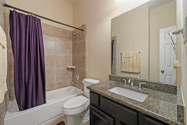 full bathroom featuring shower / bath combo, toilet, and vanity