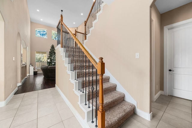 stairs featuring tile patterned floors