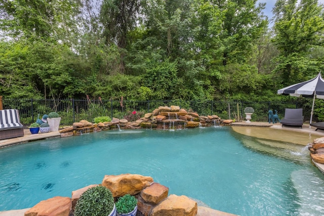 view of pool with pool water feature